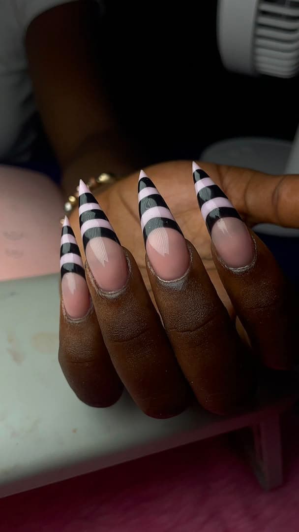 Black and white striped stiletto nails